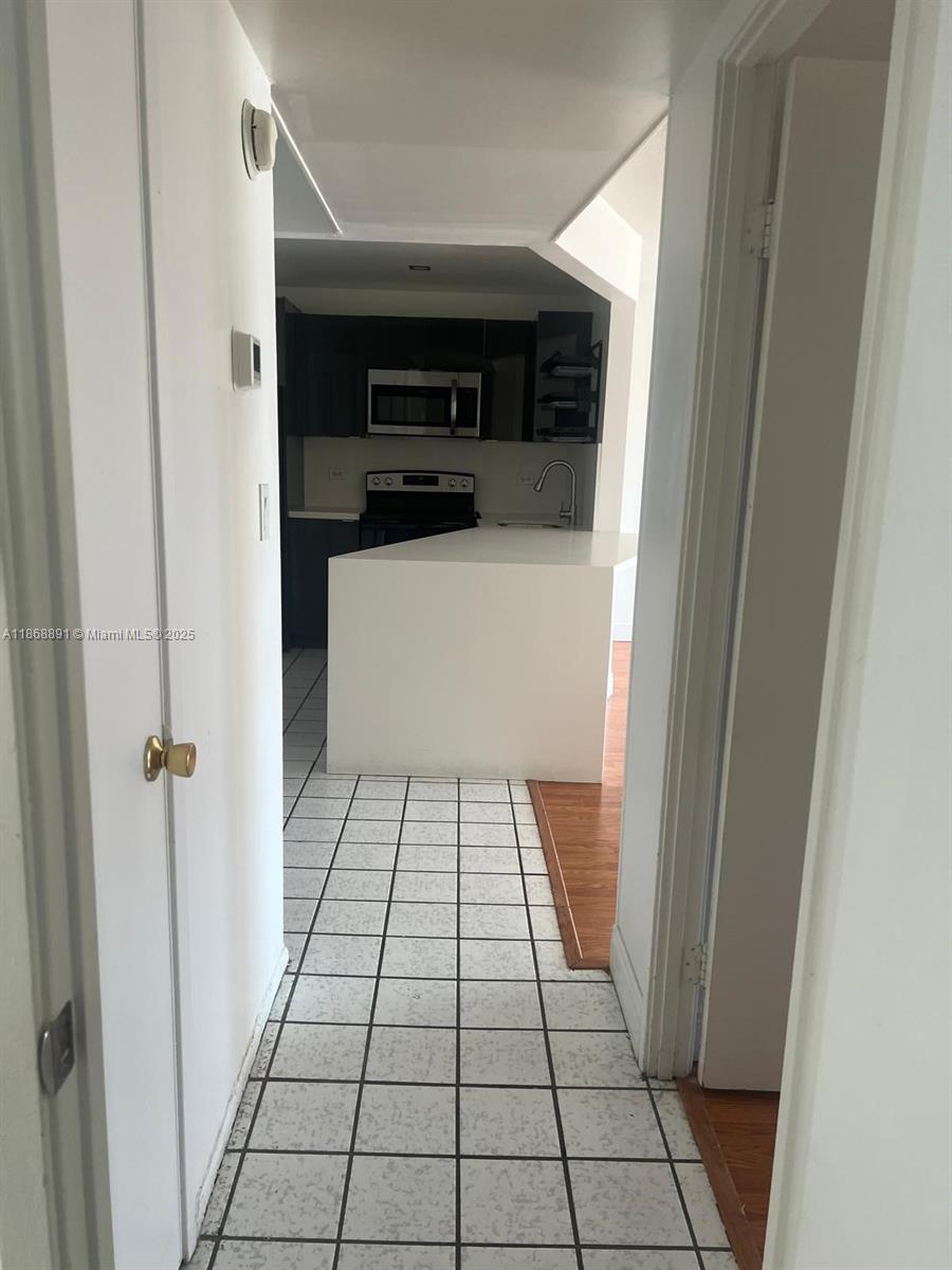 1710 Northeast 191st Street, Unit 3013 Miami, FL 33179 - Photo 10 of 23 a view of an empty walk in closet