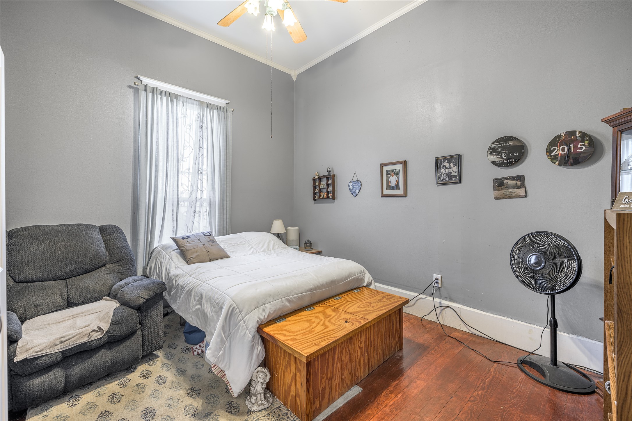 1000 North Park Street Brenham, TX 77833 - Photo 20 of 23 a bedroom with bed and a chandelier