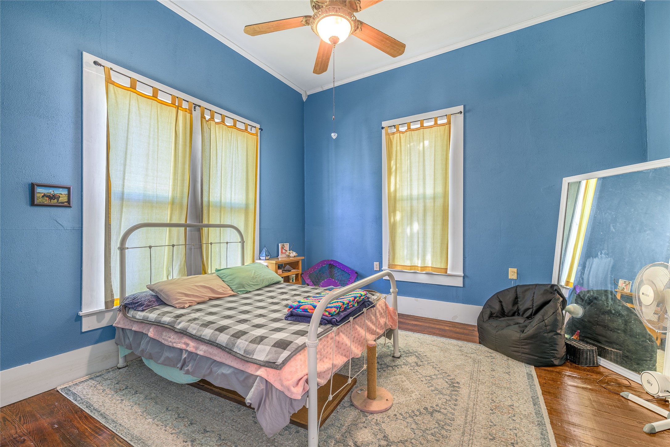 1000 North Park Street Brenham, TX 77833 - Photo 22 of 23 a bedroom with a bed and wooden floor
