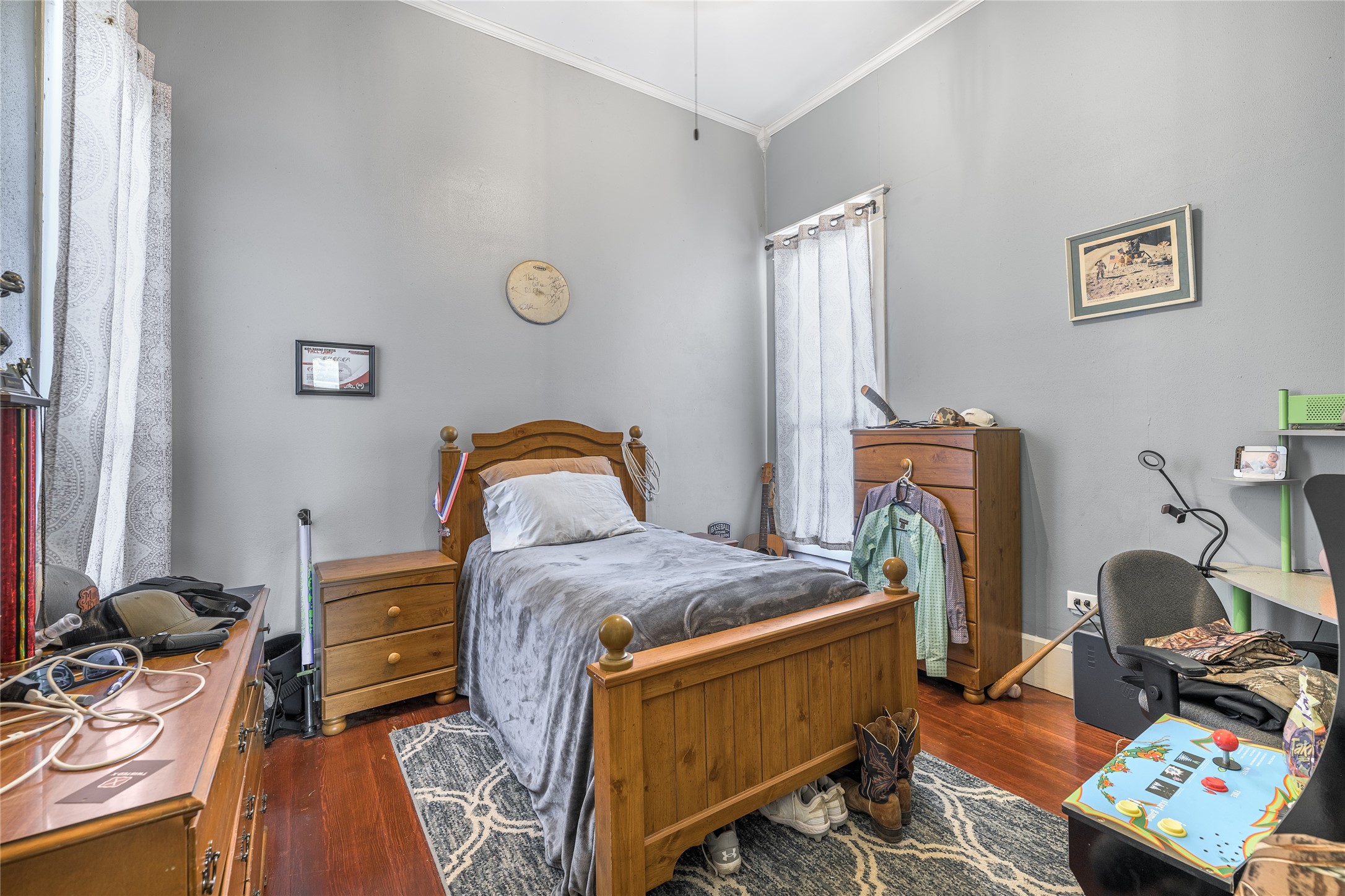 1000 North Park Street Brenham, TX 77833 - Photo 23 of 23 a bedroom with a bed and wooden floor