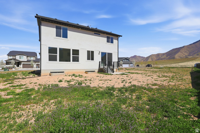 1353 Mapleton Hts Court Mapleton, UT 84664 - Photo 46 of 50 Back of house with a mountain view, stucco siding, and entry steps