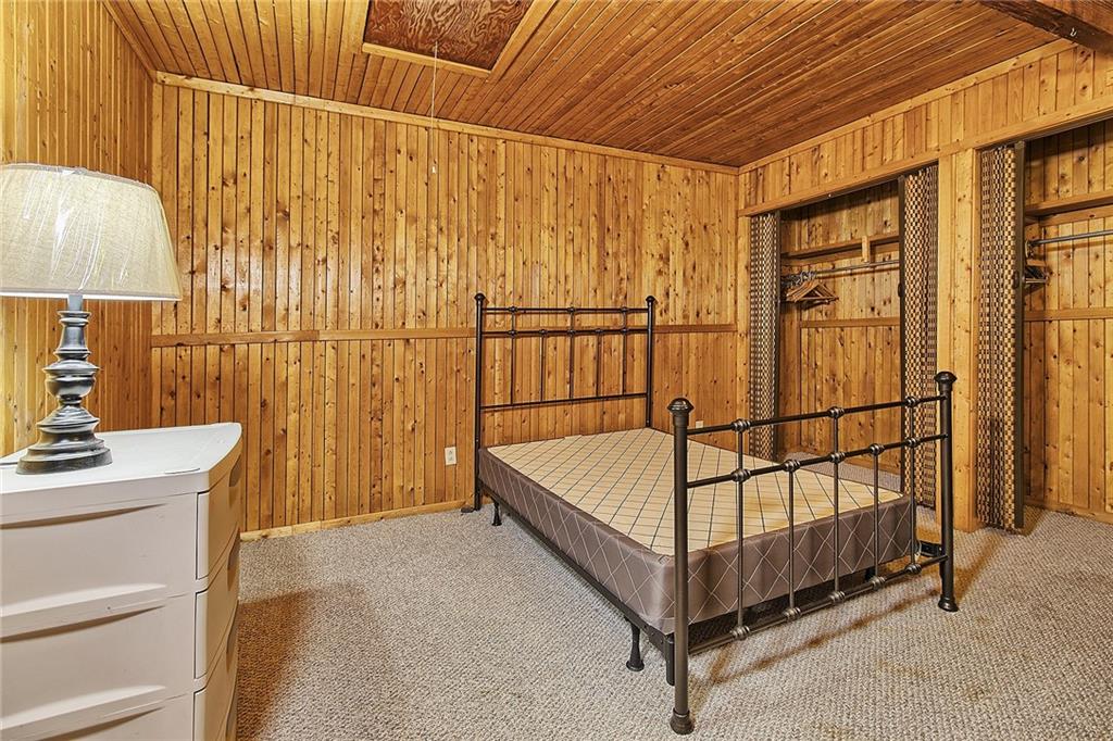 2078 Rocky Ridge Road Acme, PA 15610 - Photo 8 of 17 a bed room with a bed and a table