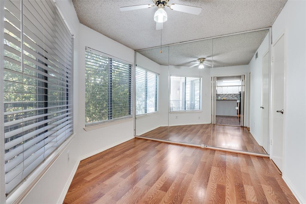 2311 Basil Drive, Unit C304 Arlington, TX 76006 - Photo 7 of 12 a view of an empty room with a window and wooden floor