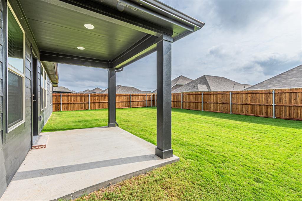 780 Moonlight Place Lavon, TX 75166 - Photo 30 of 35 Fenced backyard featuring a patio