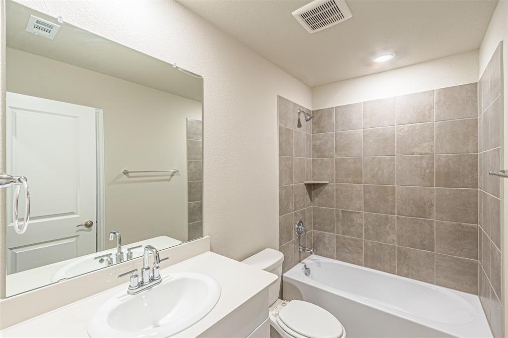 780 Moonlight Place Lavon, TX 75166 - Photo 8 of 35 Full bath with shower / bath combination, vanity, and a textured wall
