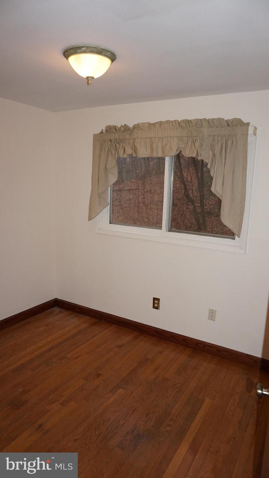 1270 Old Landing Road Accokeek, MD 20607 - Photo 22 of 48 an empty room with wooden floor