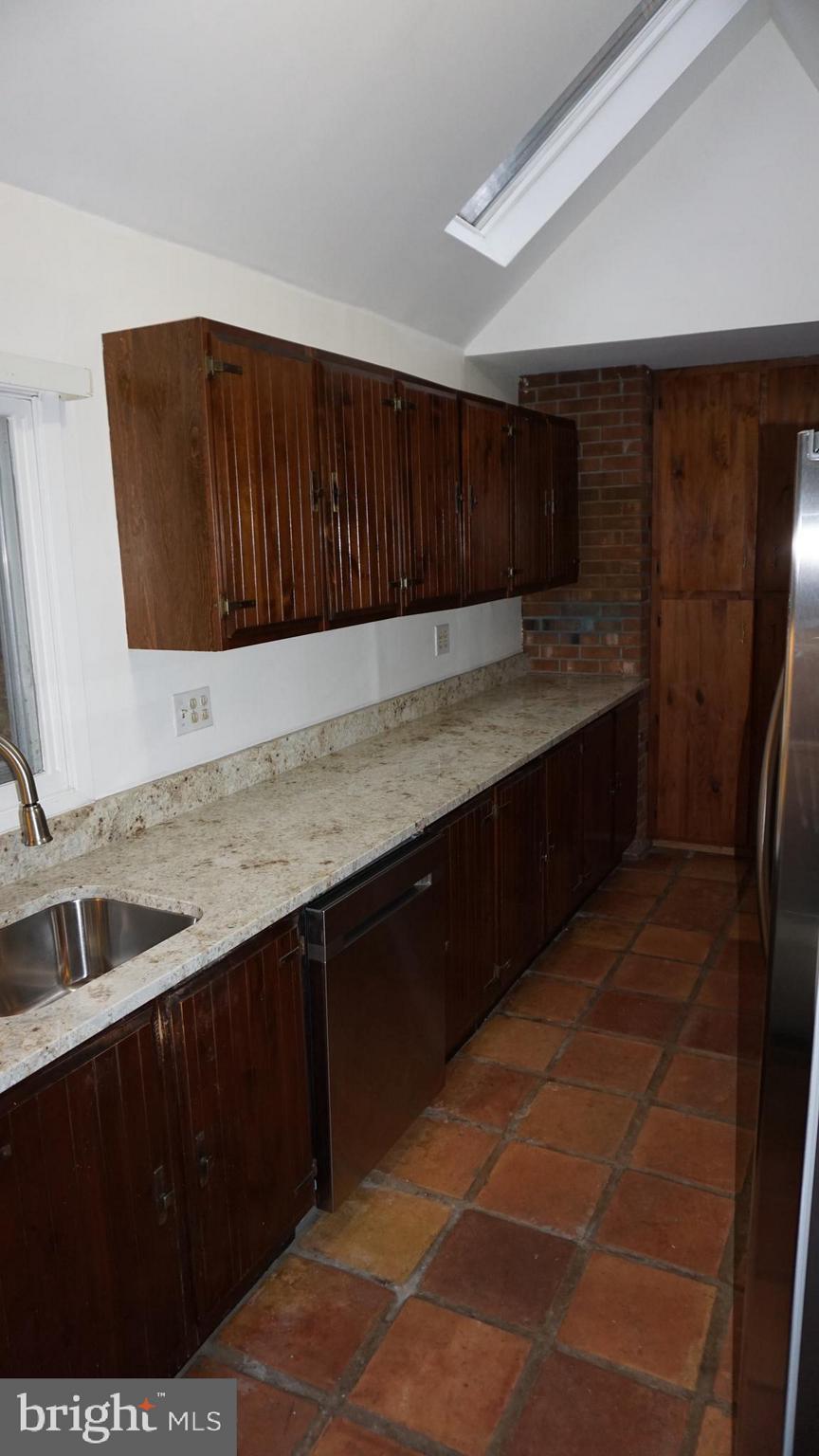 1270 Old Landing Road Accokeek, MD 20607 - Photo 8 of 48 a kitchen with a sink and cabinets