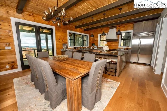 a bed sitting in a bedroom next to a large window