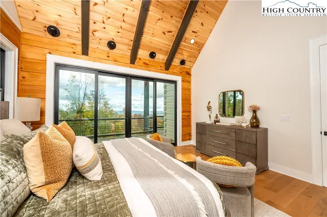 a bathroom with double vanity and a mirror