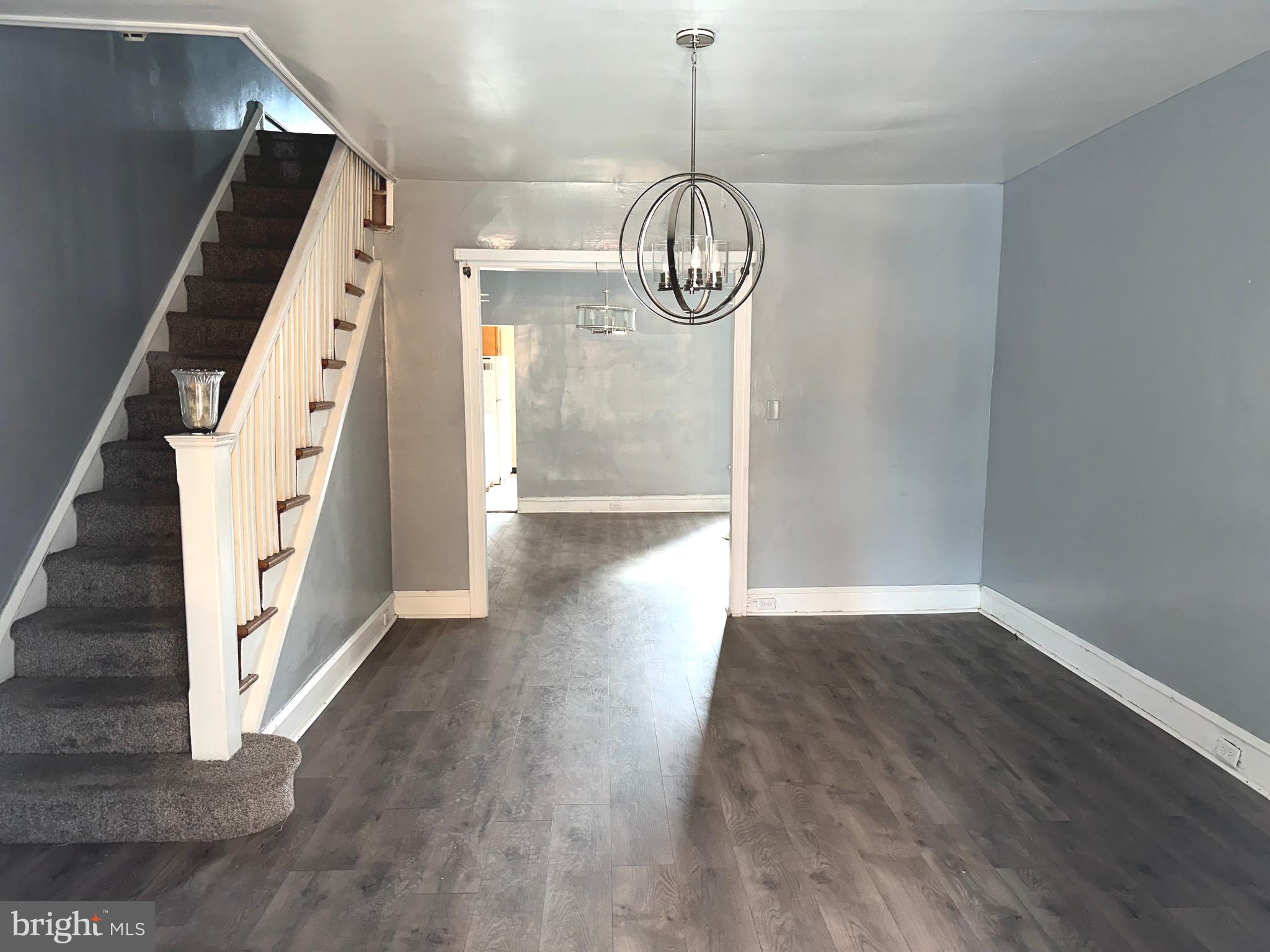 5332 Master Street Philadelphia, PA 19131 - Photo 1 of 17 a view of a hallway with wooden floor and staircase