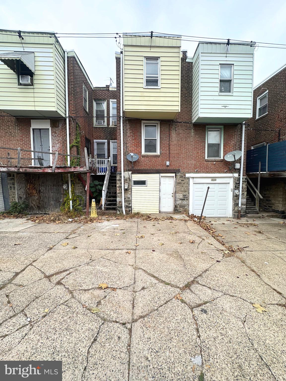 5332 Master Street Philadelphia, PA 19131 - Photo 17 of 17 a front view of a house with a yard