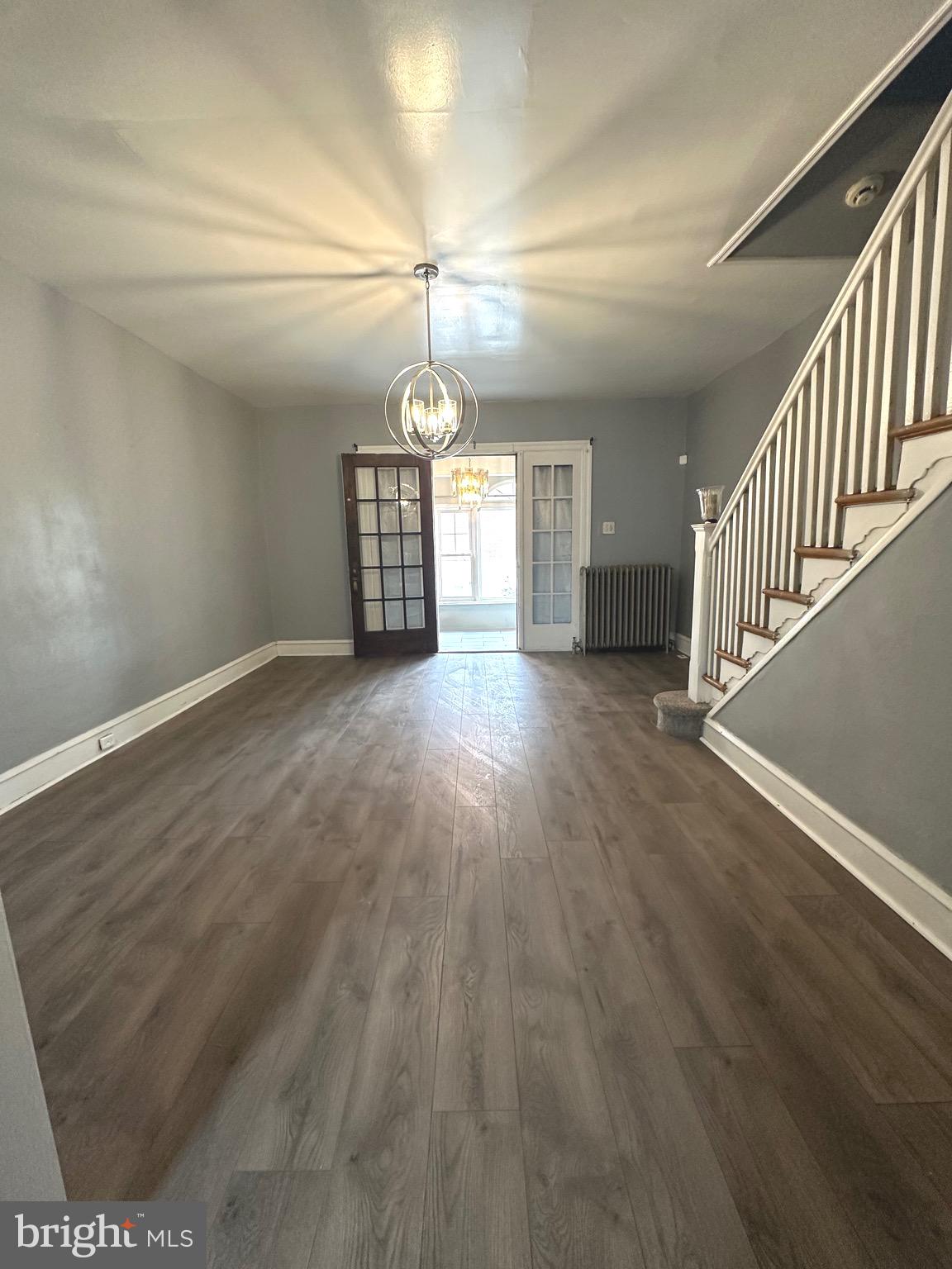 5332 Master Street Philadelphia, PA 19131 - Photo 2 of 17 an empty room with stairs and wooden floor