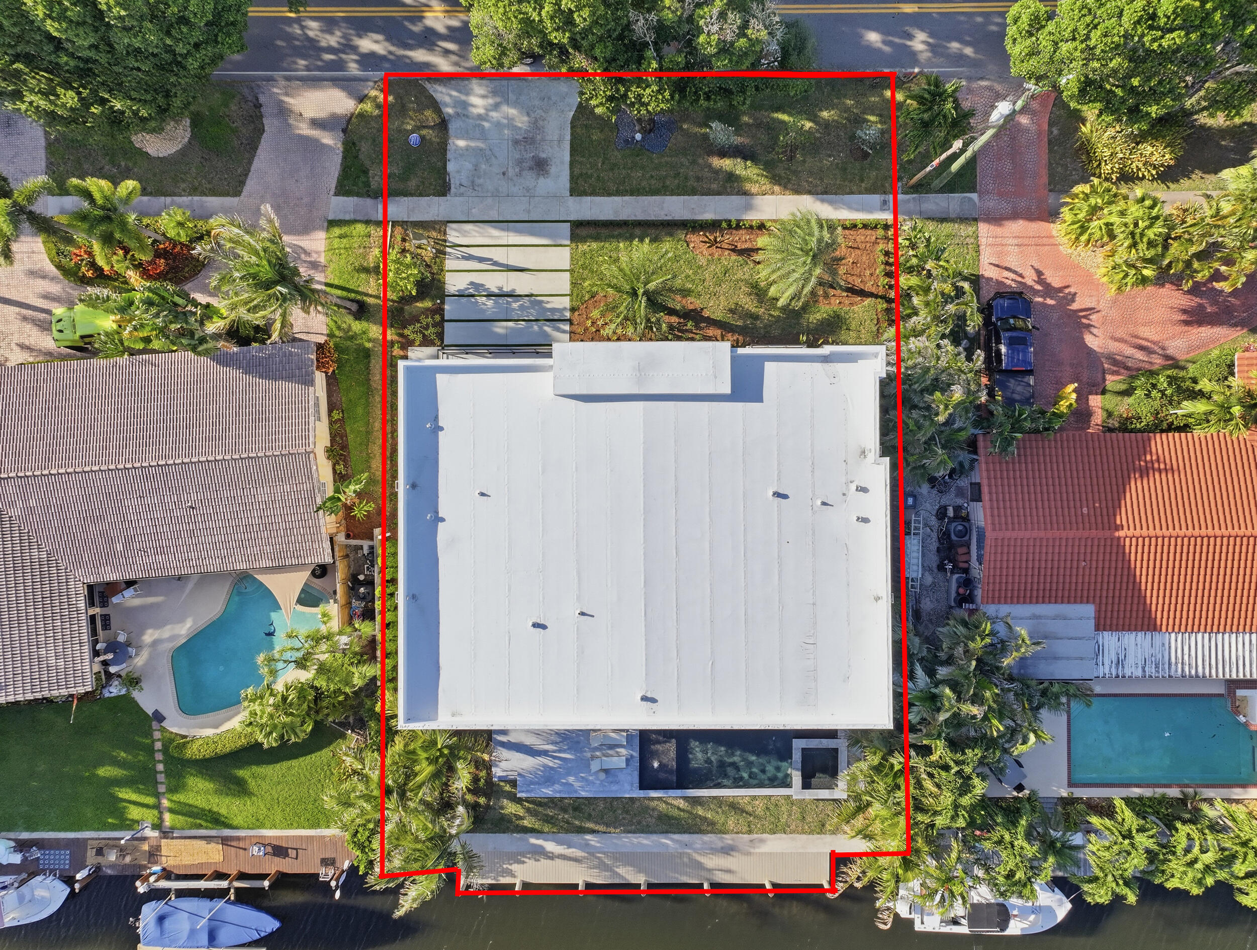 2360 Northeast 49th Street Lighthouse Point, FL 33064 - Photo 62 of 66 an aerial view of a house with a yard and a fountain