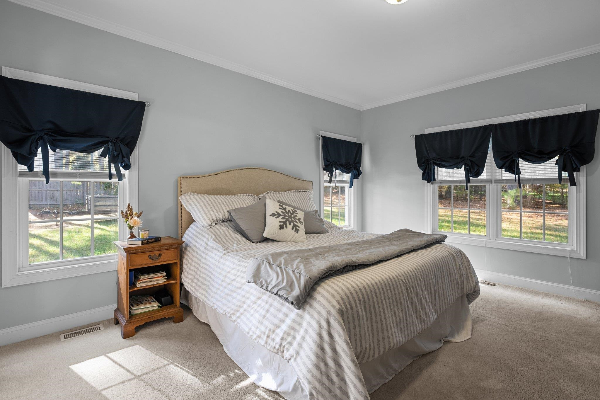 104 Shadow Lane Oxford, NC 27565 - Photo 14 of 38 a bedroom with a large bed and a window