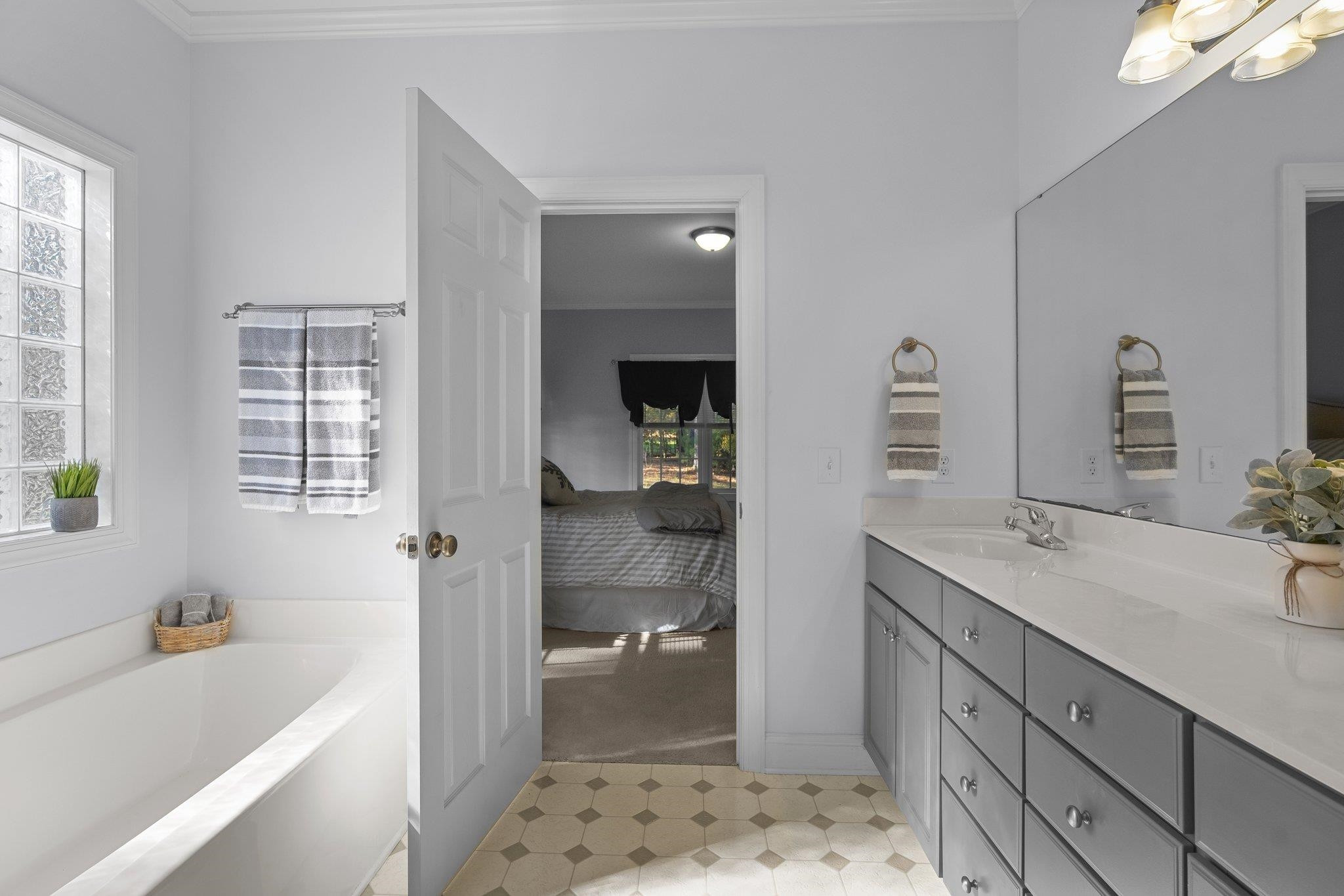 104 Shadow Lane Oxford, NC 27565 - Photo 15 of 38 a bathroom with a tub sink and mirror
