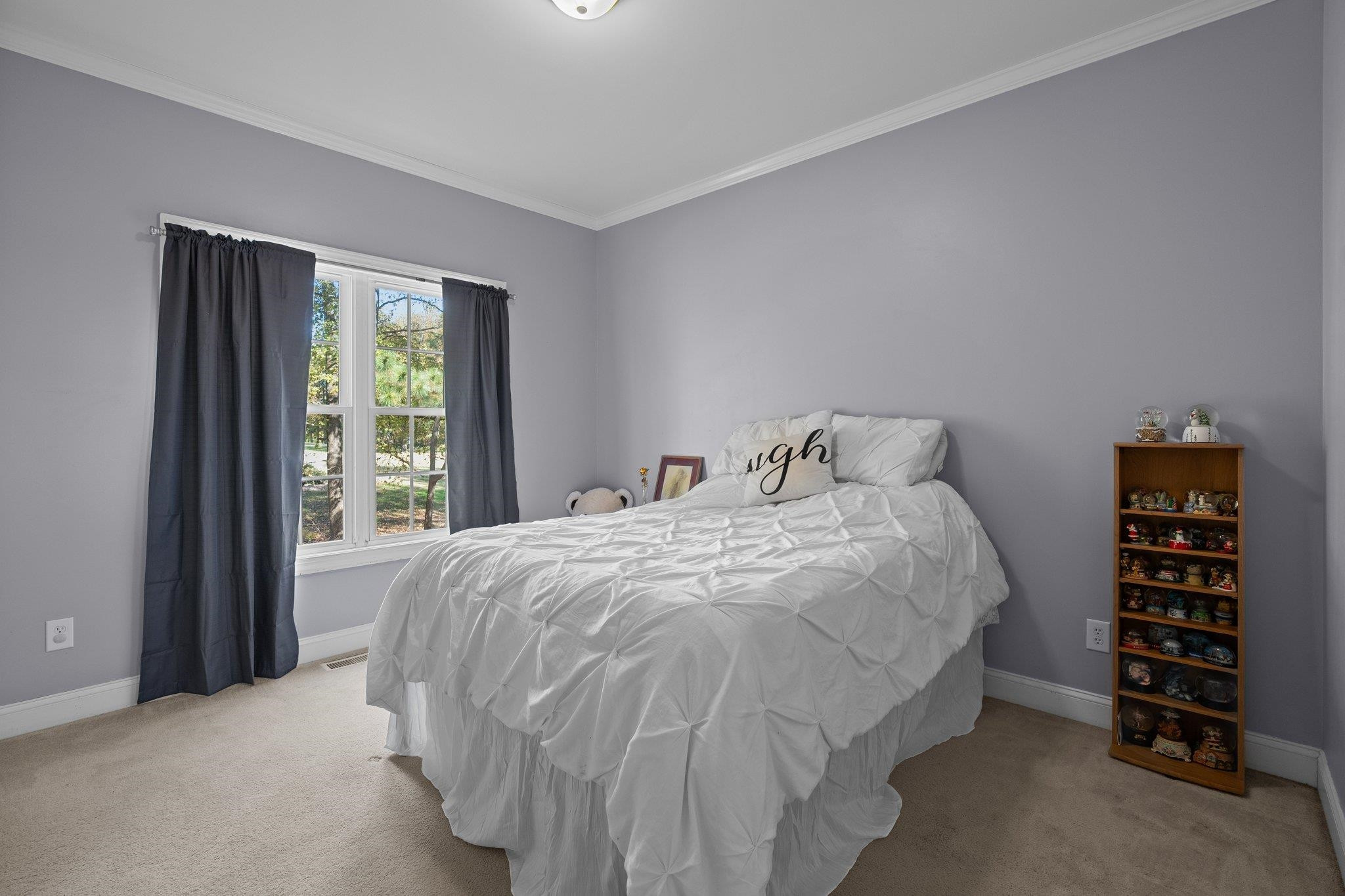 104 Shadow Lane Oxford, NC 27565 - Photo 24 of 38 a bedroom with a bed and a window