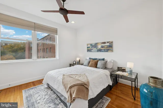 a bedroom with a bed and chair