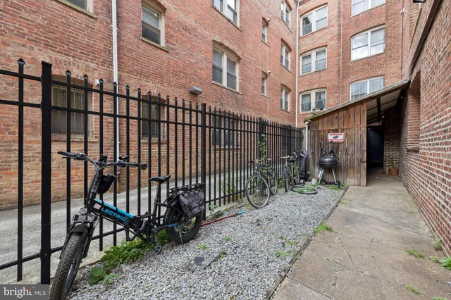 a view of a building with brick walls