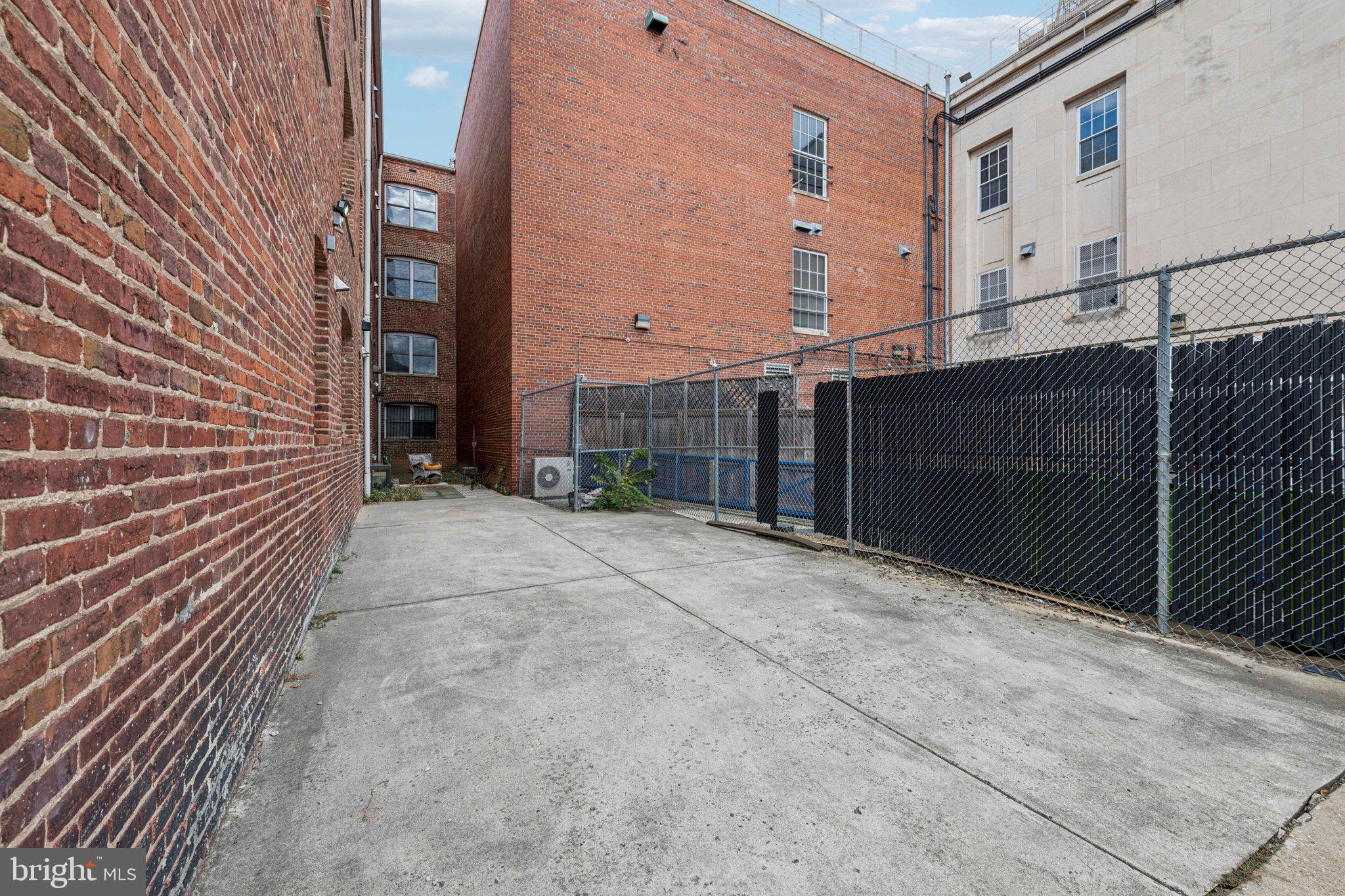 1438 Columbia Road Northwest, Unit 305 Washington, DC 20009 - Photo 21 of 22 a view of a building with brick walls