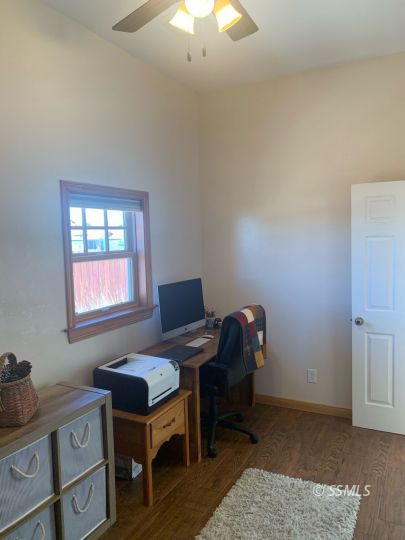 600 South Erin Street Ridgecrest, CA 93555 - Photo 30 of 39 a view of a workspace with furniture and a window