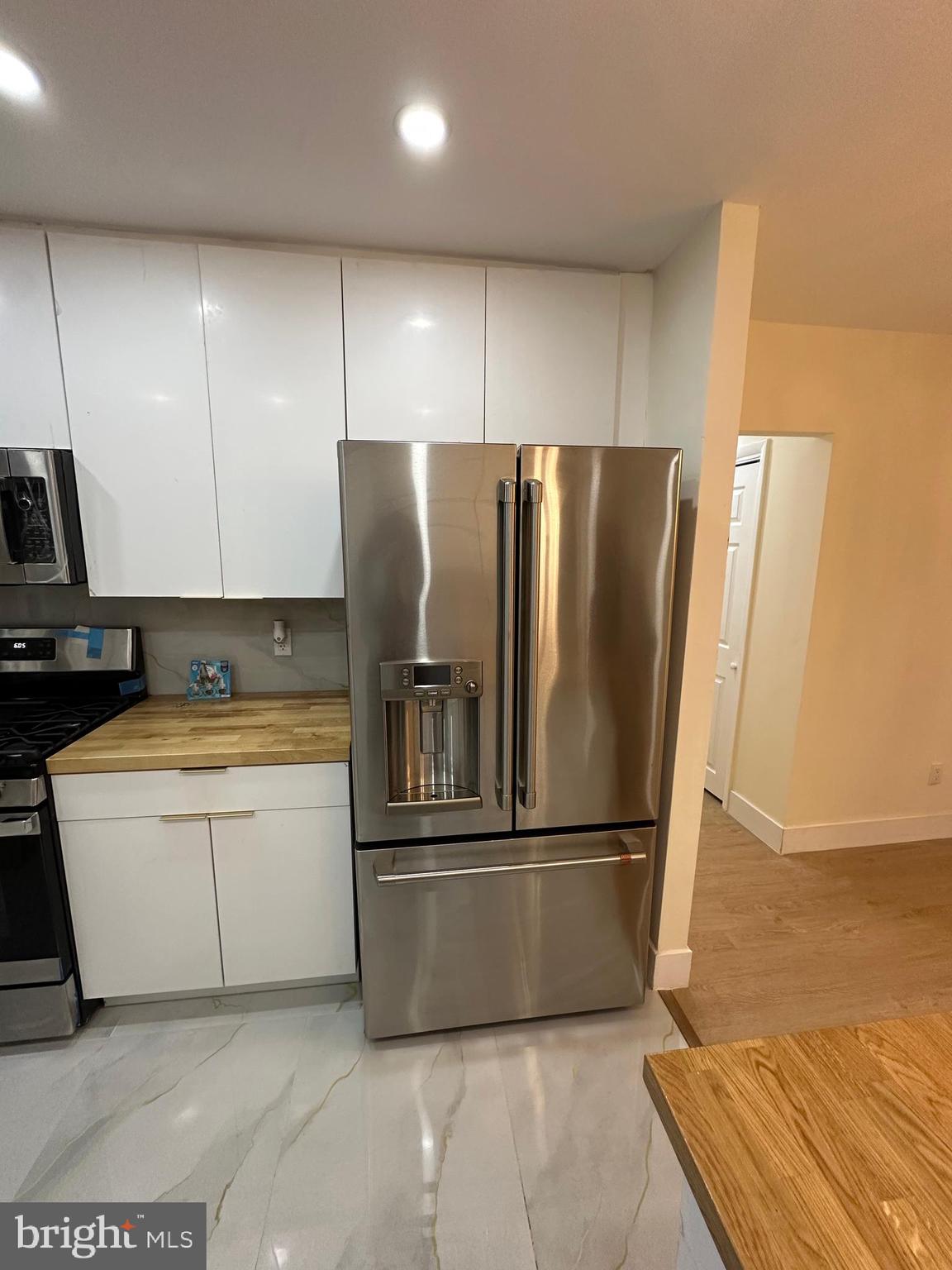 8540 Castor Avenue Philadelphia, PA 19152 - Photo 11 of 23 a kitchen with granite countertop a refrigerator and a sink