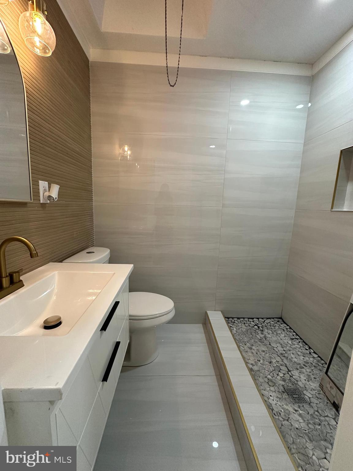 8540 Castor Avenue Philadelphia, PA 19152 - Photo 17 of 23 a bathroom with a sink a toilet and shower