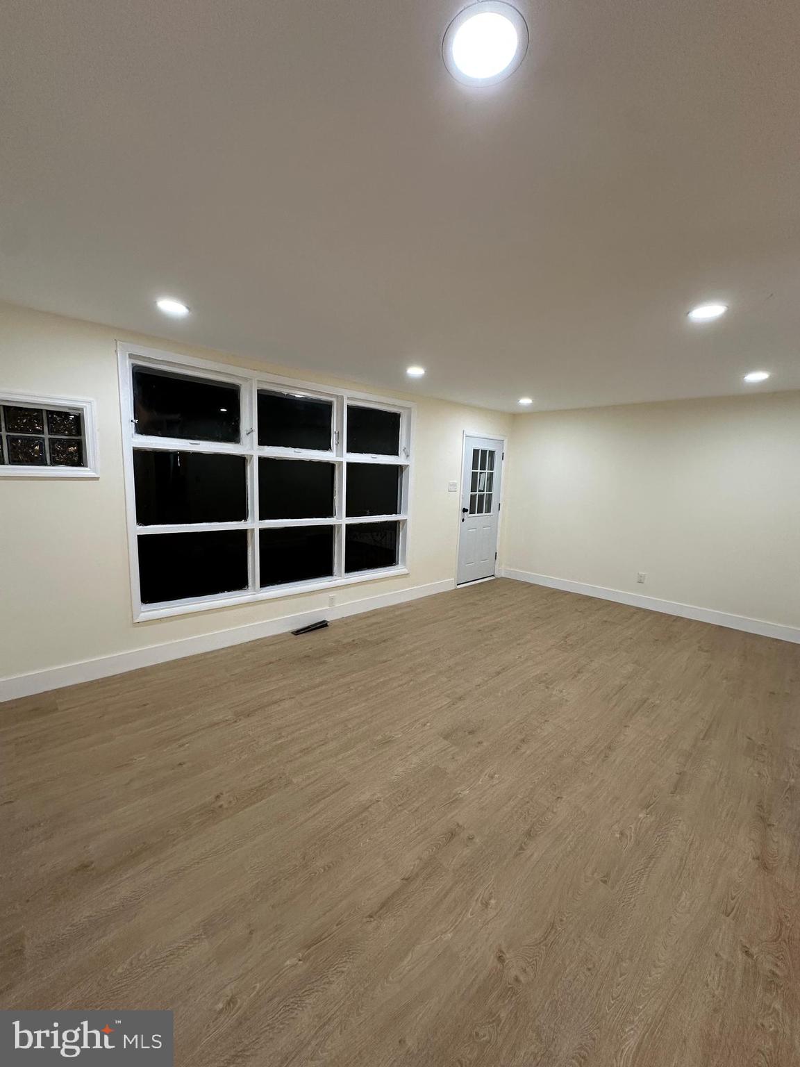 8540 Castor Avenue Philadelphia, PA 19152 - Photo 2 of 23 a view of an empty room with a fireplace and cabinet