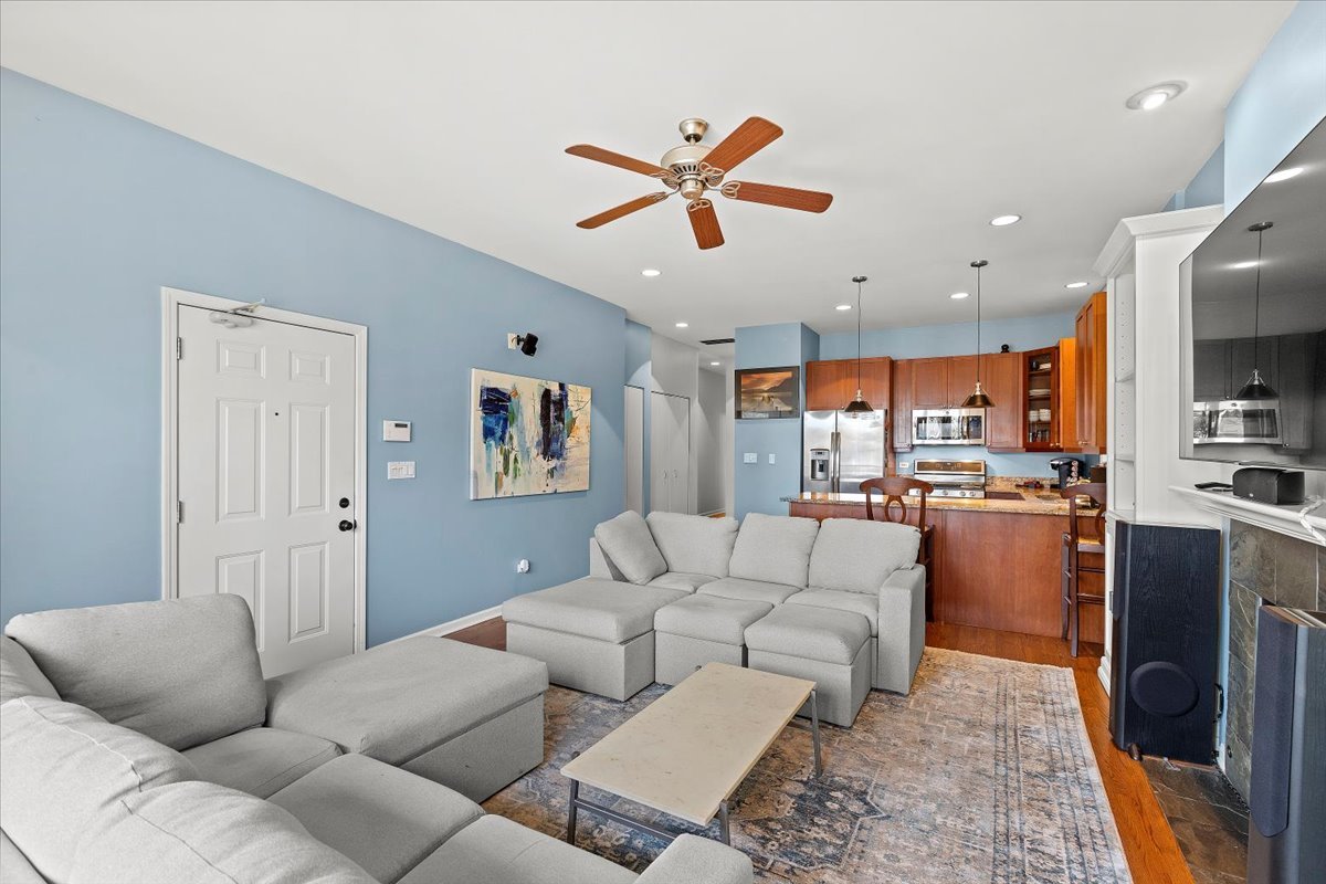 2025 West Rice Street, Unit 2 Chicago, IL 60622 - Photo 8 of 17 a living room with furniture kitchen view and a window