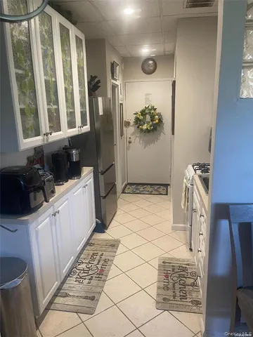 a bathroom with a sink a mirror and a shower