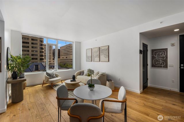 a view of living room with furniture and a potted plant
