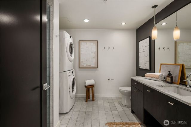 a bathroom with a toilet a sink and a mirror