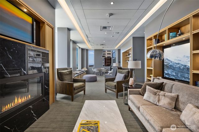 a living room with furniture and a large window