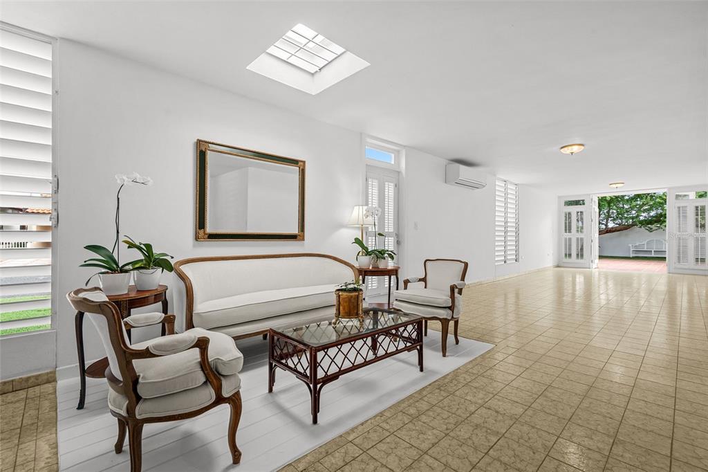 7 Barcelona Street Humacao, PR 00791 - Photo 5 of 16 a living room with furniture and a window