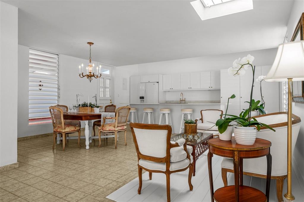 7 Barcelona Street Humacao, PR 00791 - Photo 7 of 16 a view of a dining room with furniture and chandelier