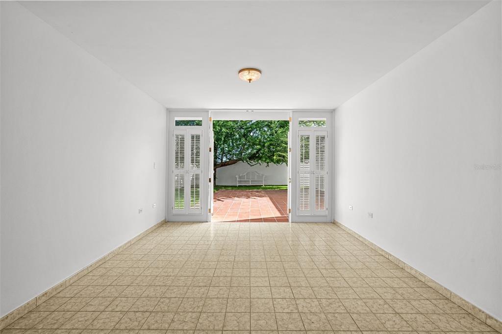 7 Barcelona Street Humacao, PR 00791 - Photo 8 of 16 an empty room with large windows