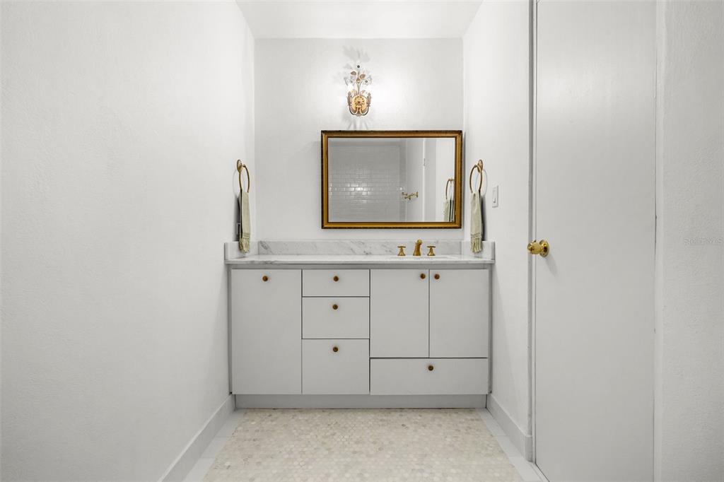 7 Barcelona Street Humacao, PR 00791 - Photo 10 of 16 a bathroom with a sink a vanity and a mirror