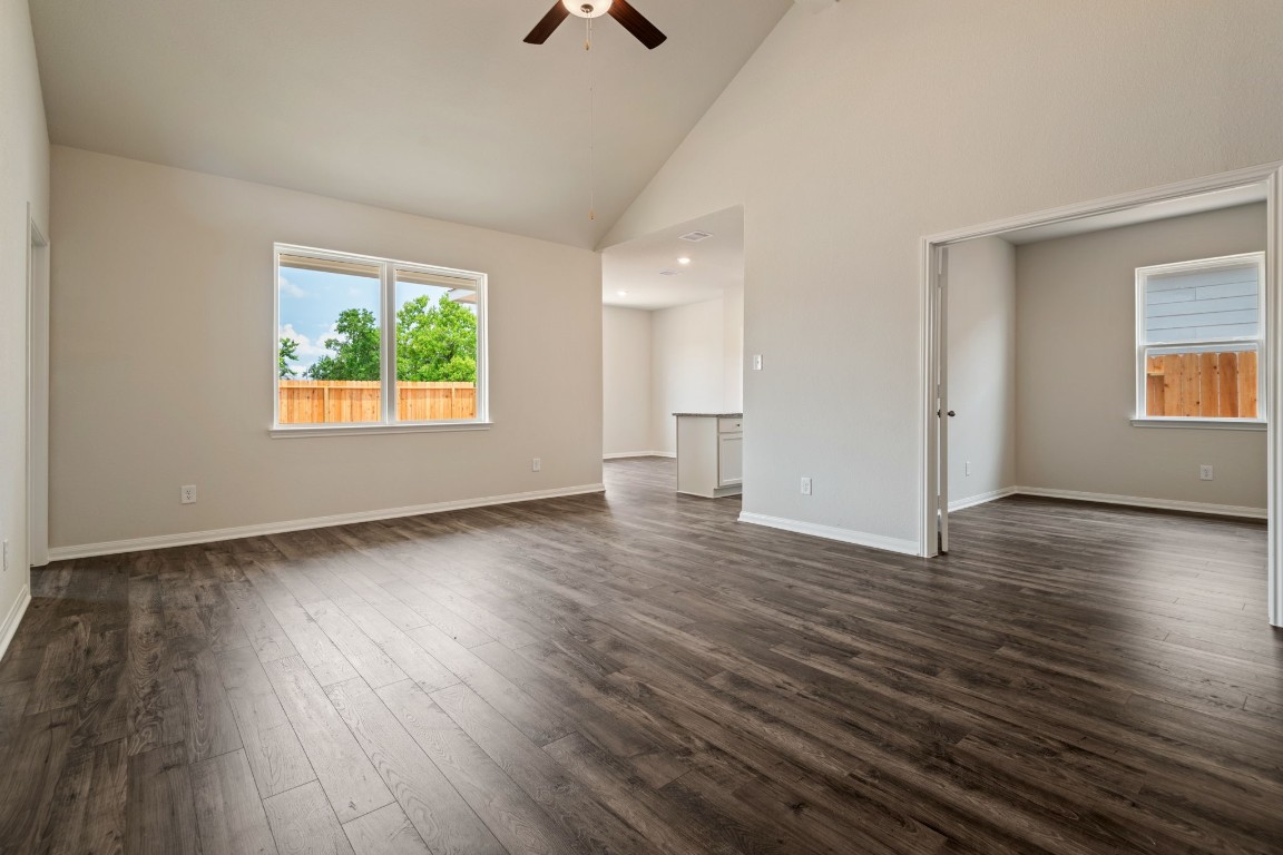 345 Fastboy Lane Waller, TX 77484 - Photo 2 of 12 an empty room with wooden floor and windows