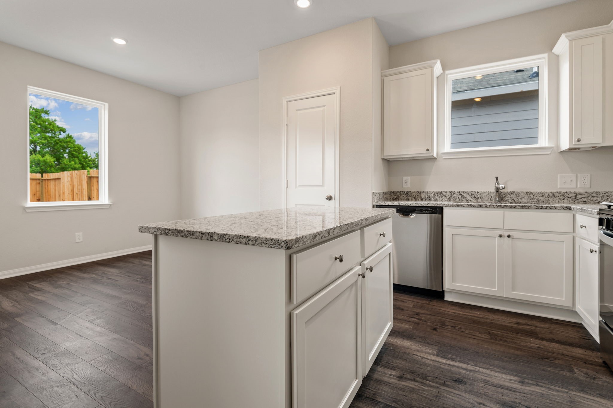345 Fastboy Lane Waller, TX 77484 - Photo 5 of 12 a kitchen with granite countertop a sink cabinets stainless steel appliances and a window
