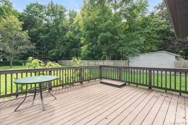 a view of a wooden deck with a trees