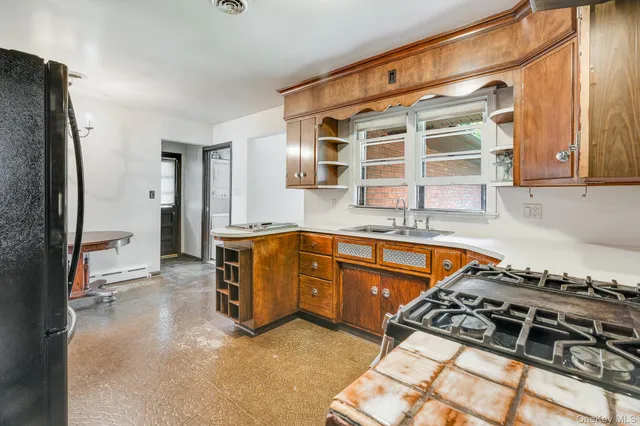 a kitchen with stainless steel appliances granite countertop a stove and a sink