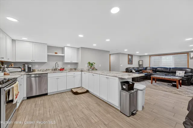 a kitchen with a sink and wooden cabinets