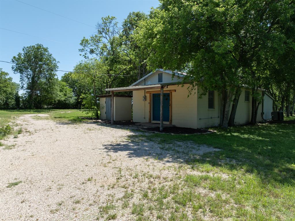 1355 North Houston Street Lorena, TX 76655 - Photo 8 of 40 a front view of a house with a yard