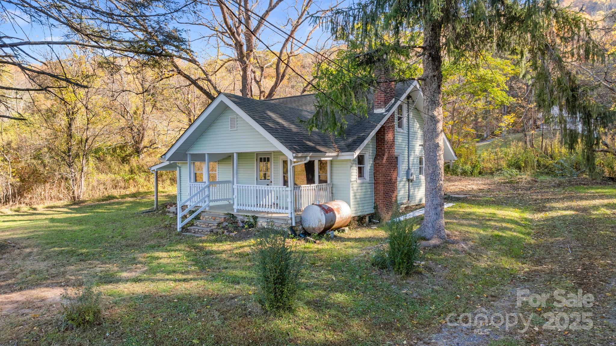 a backyard of a house with lots of green space