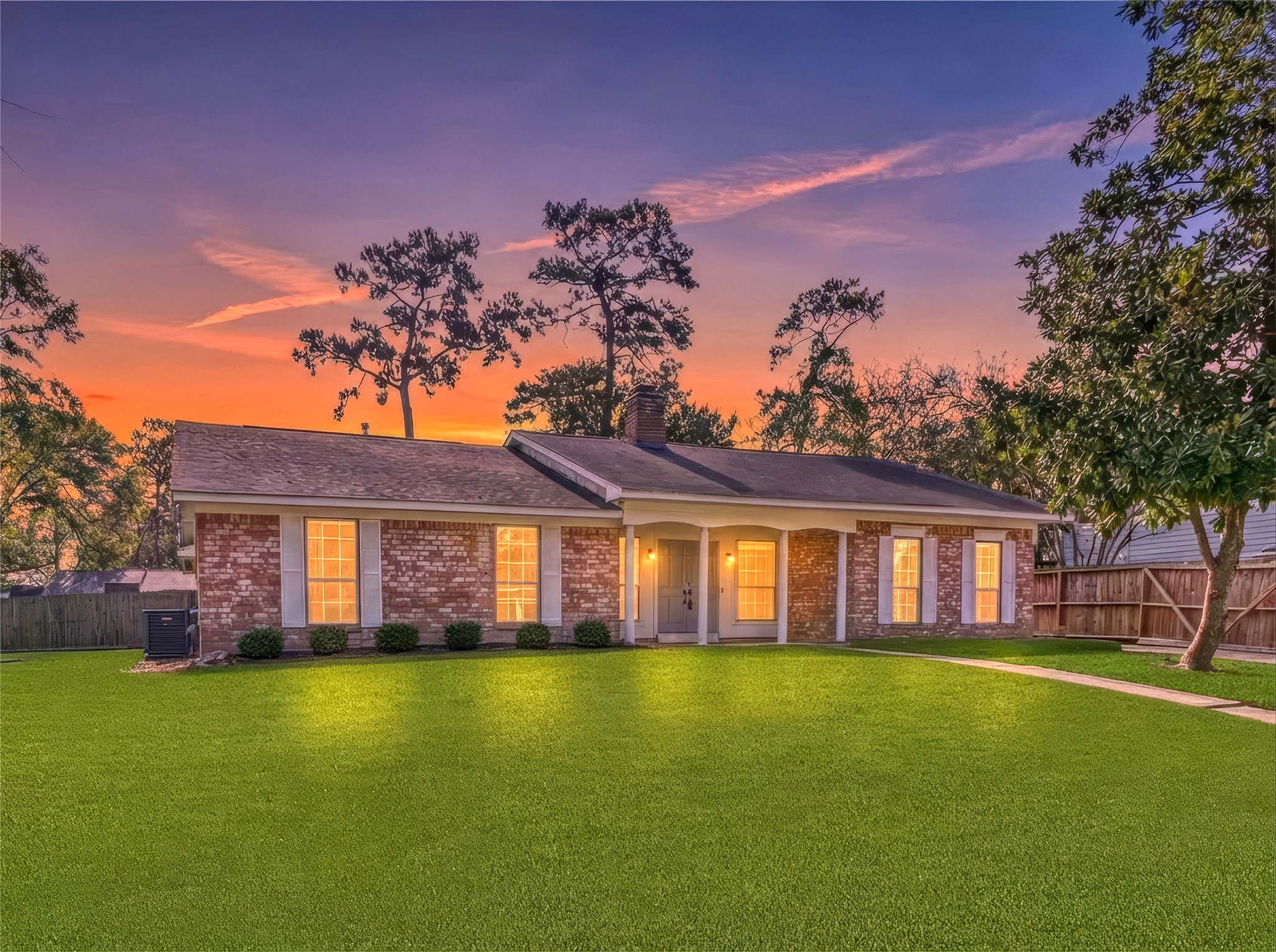 27210 Jimmy Lane Conroe, TX 77385 - Photo 1 of 43 a front view of a house with a garden