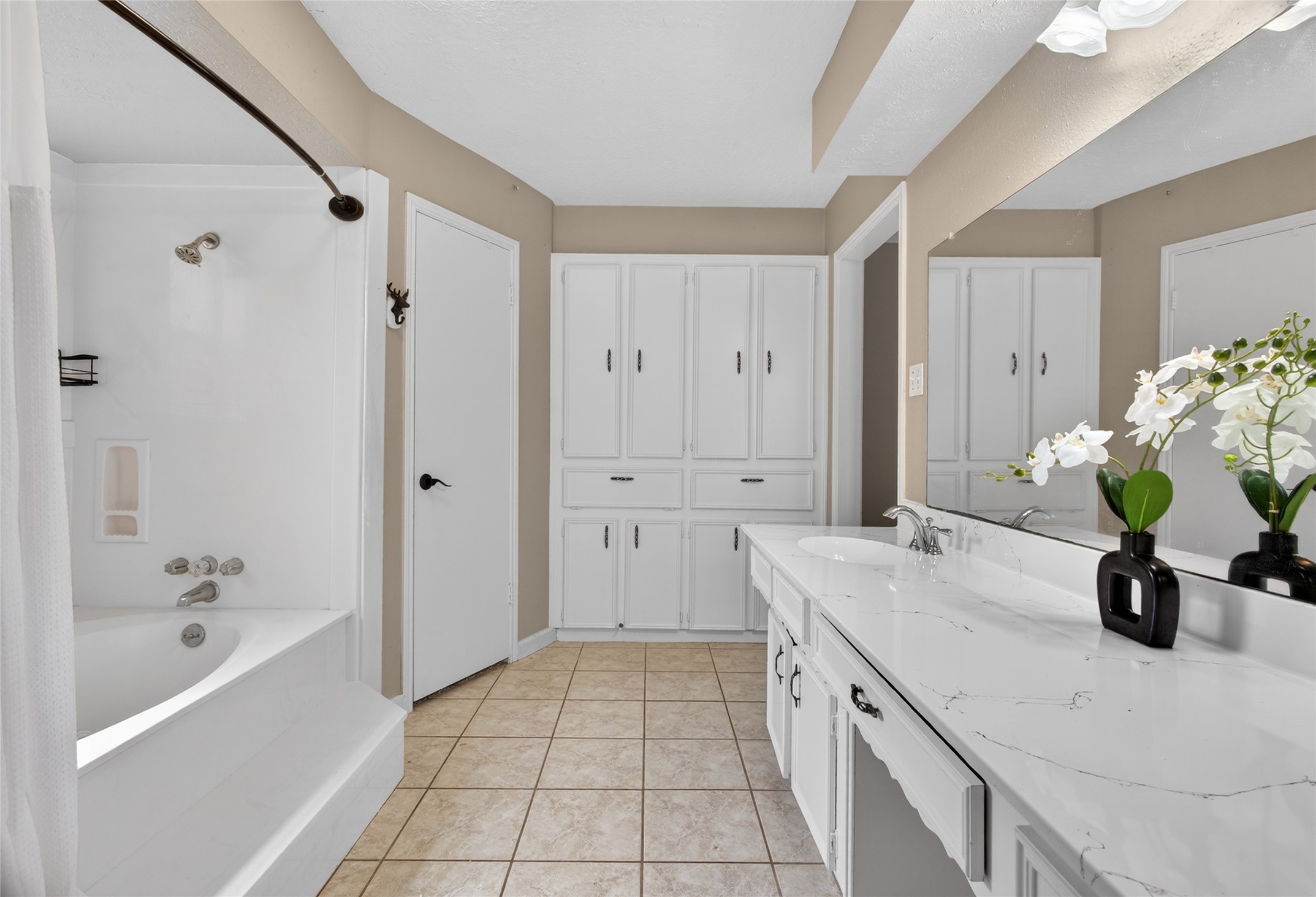 27210 Jimmy Lane Conroe, TX 77385 - Photo 22 of 43 a bathroom with a double vanity sink and a bathtub