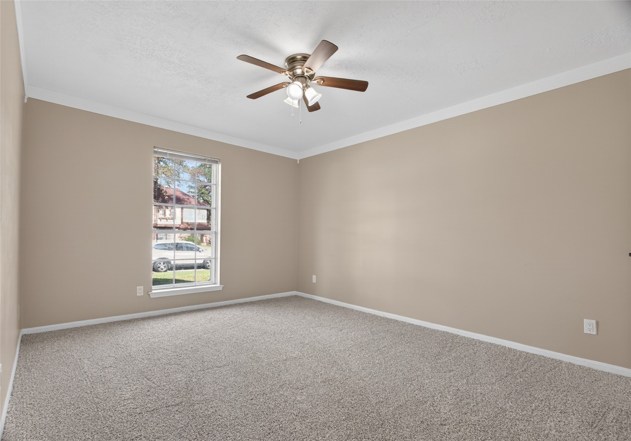 27210 Jimmy Lane Conroe, TX 77385 - Photo 25 of 43 an empty room with windows and fan view