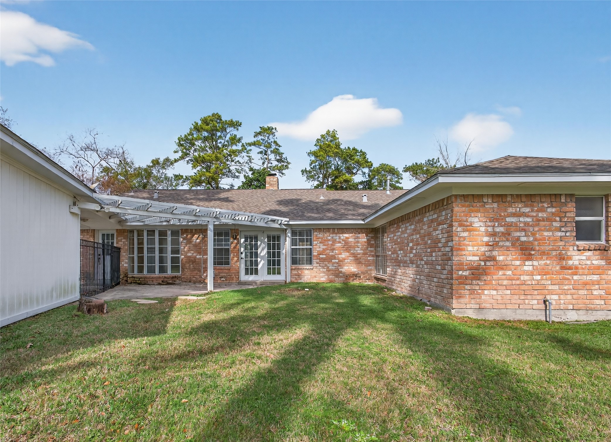 27210 Jimmy Lane Conroe, TX 77385 - Photo 30 of 43 a view of a house with a backyard