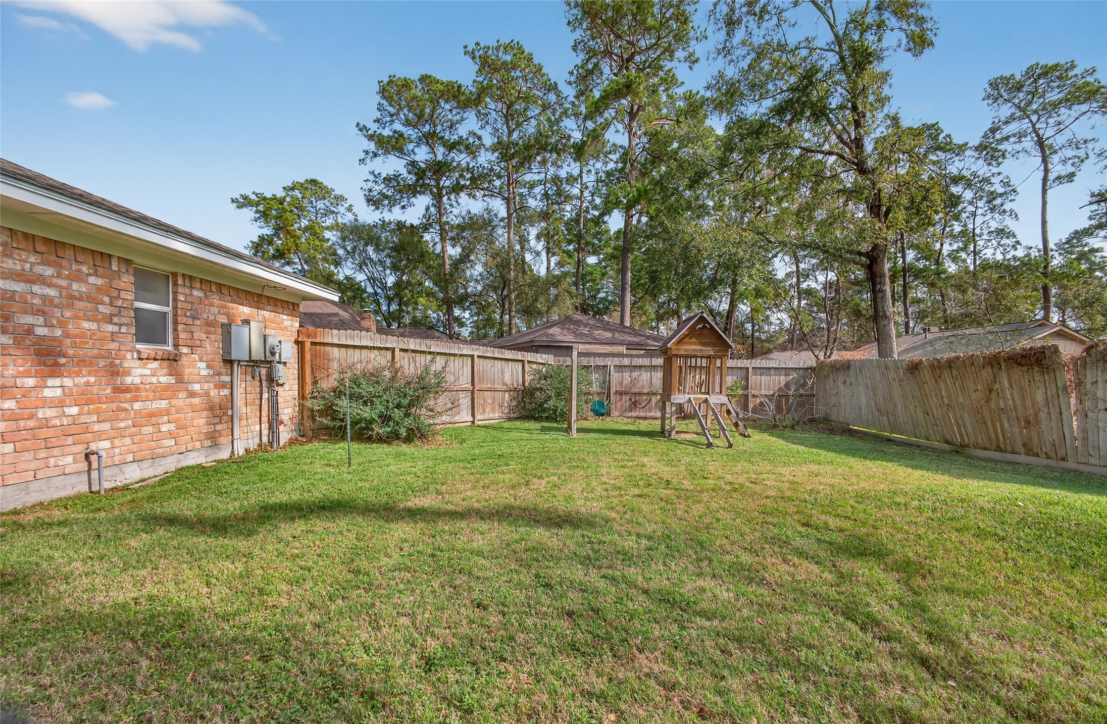 27210 Jimmy Lane Conroe, TX 77385 - Photo 31 of 43 a view of a backyard with large trees and plants