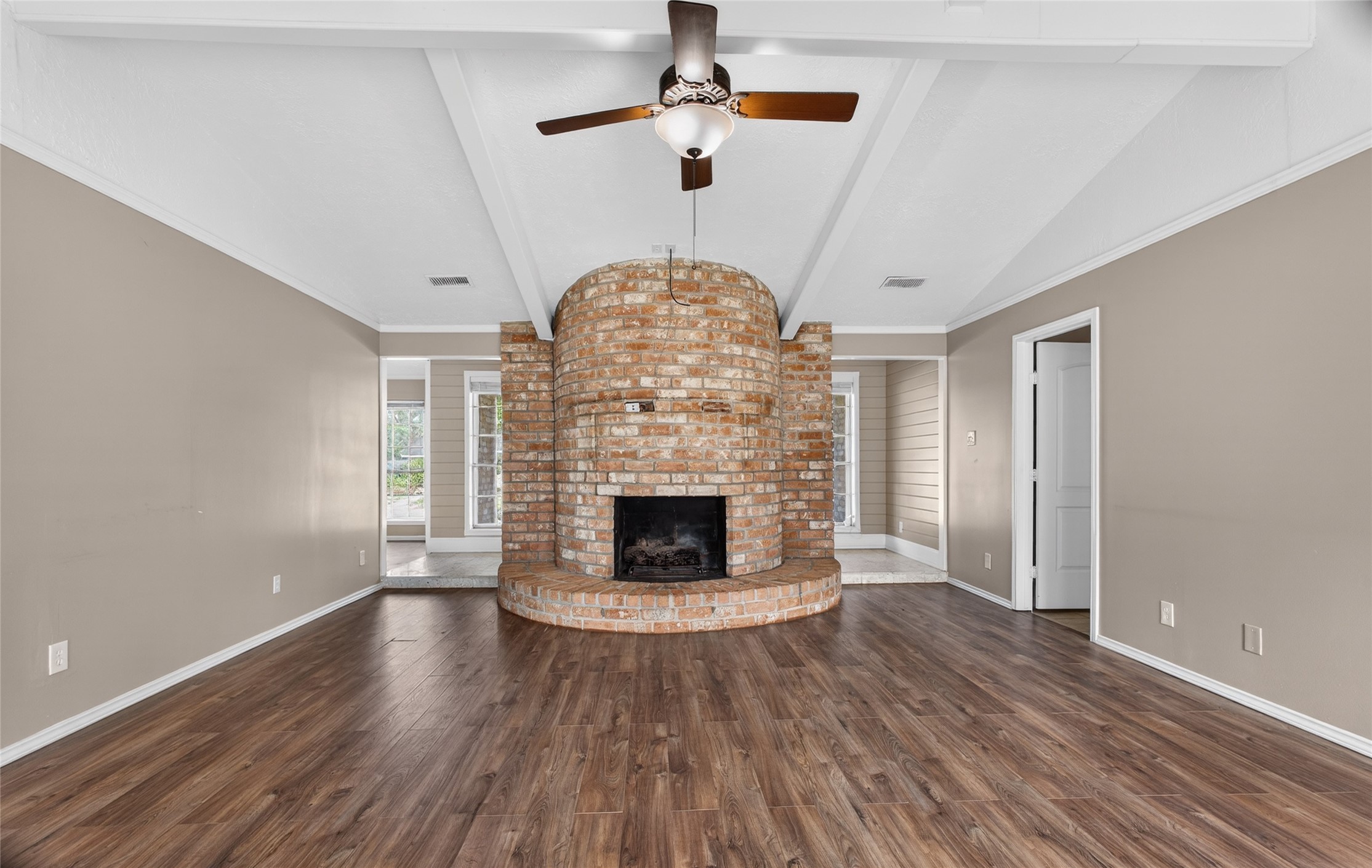 27210 Jimmy Lane Conroe, TX 77385 - Photo 9 of 43 a living room with wooden floors and a fireplace