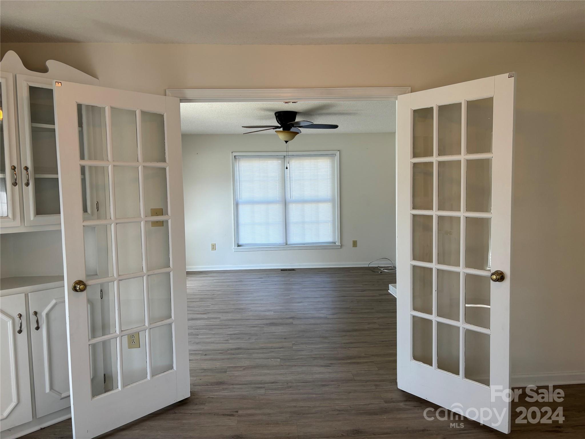 2145 East Holly Grove Road Lexington, NC 27292 - Photo 12 of 19 an empty room with windows and cabinet
